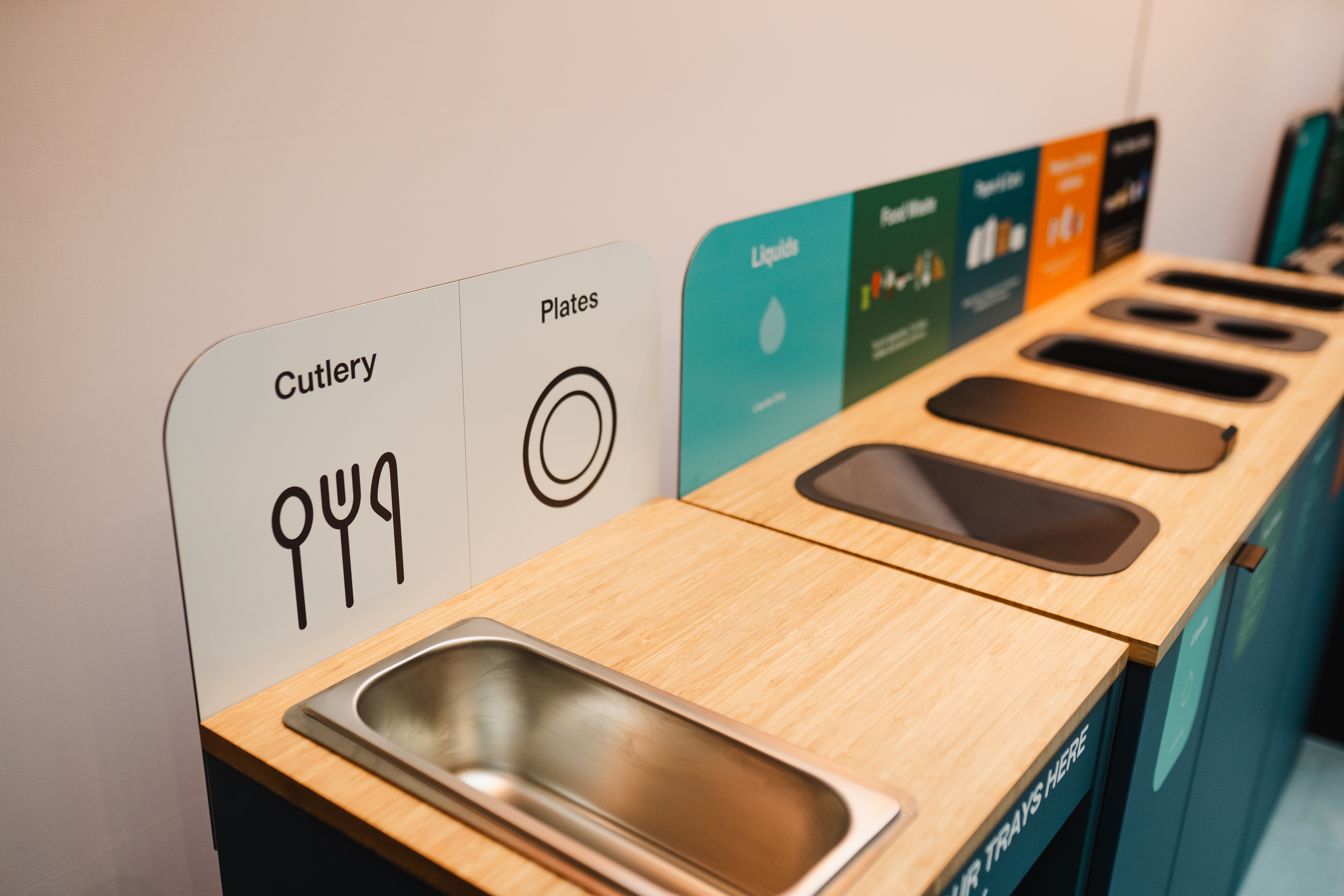 a row of recycling bins 